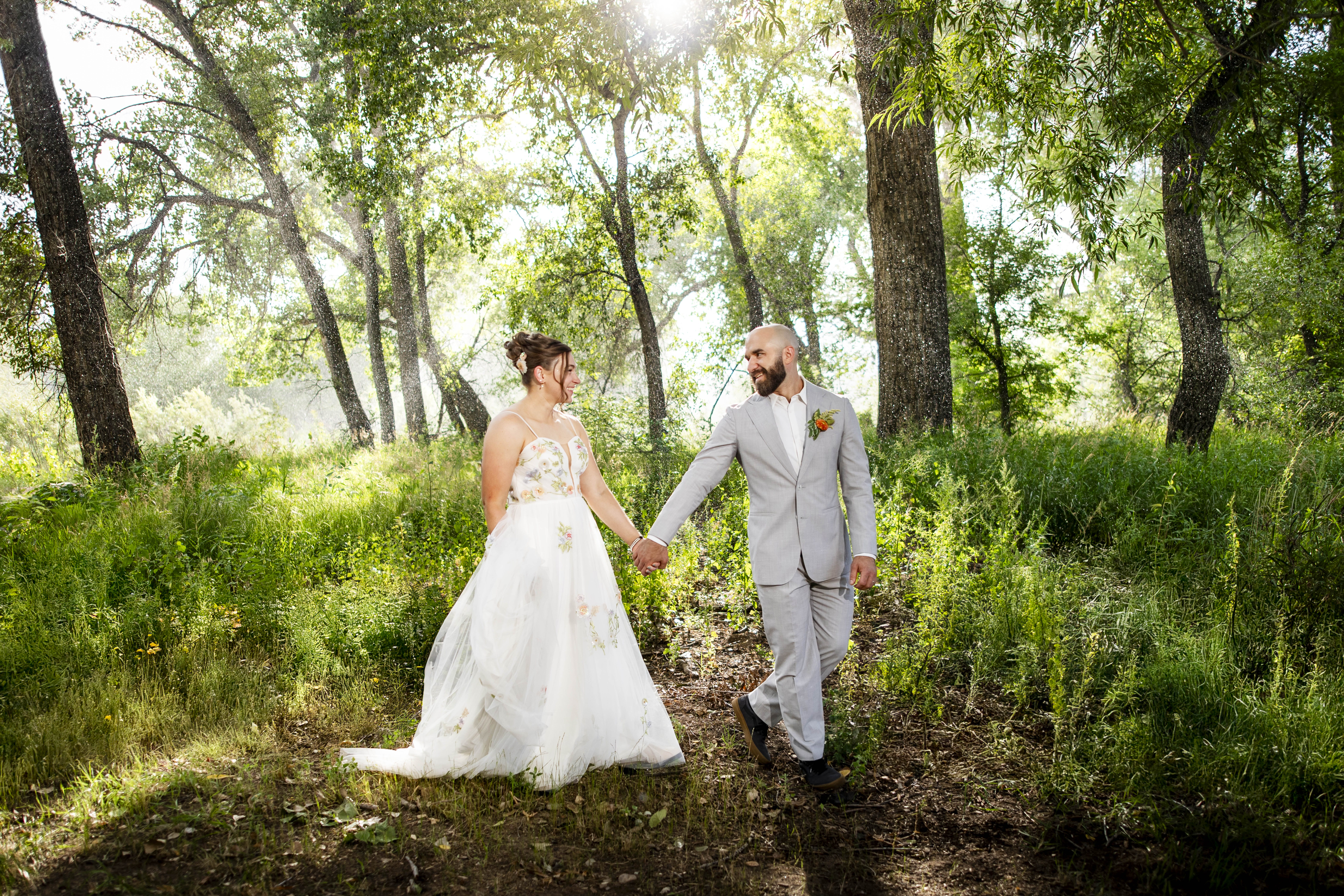 Rain behind bride and groom at nerdy winery loveland colorado wedding Colorado Wedding Photographer